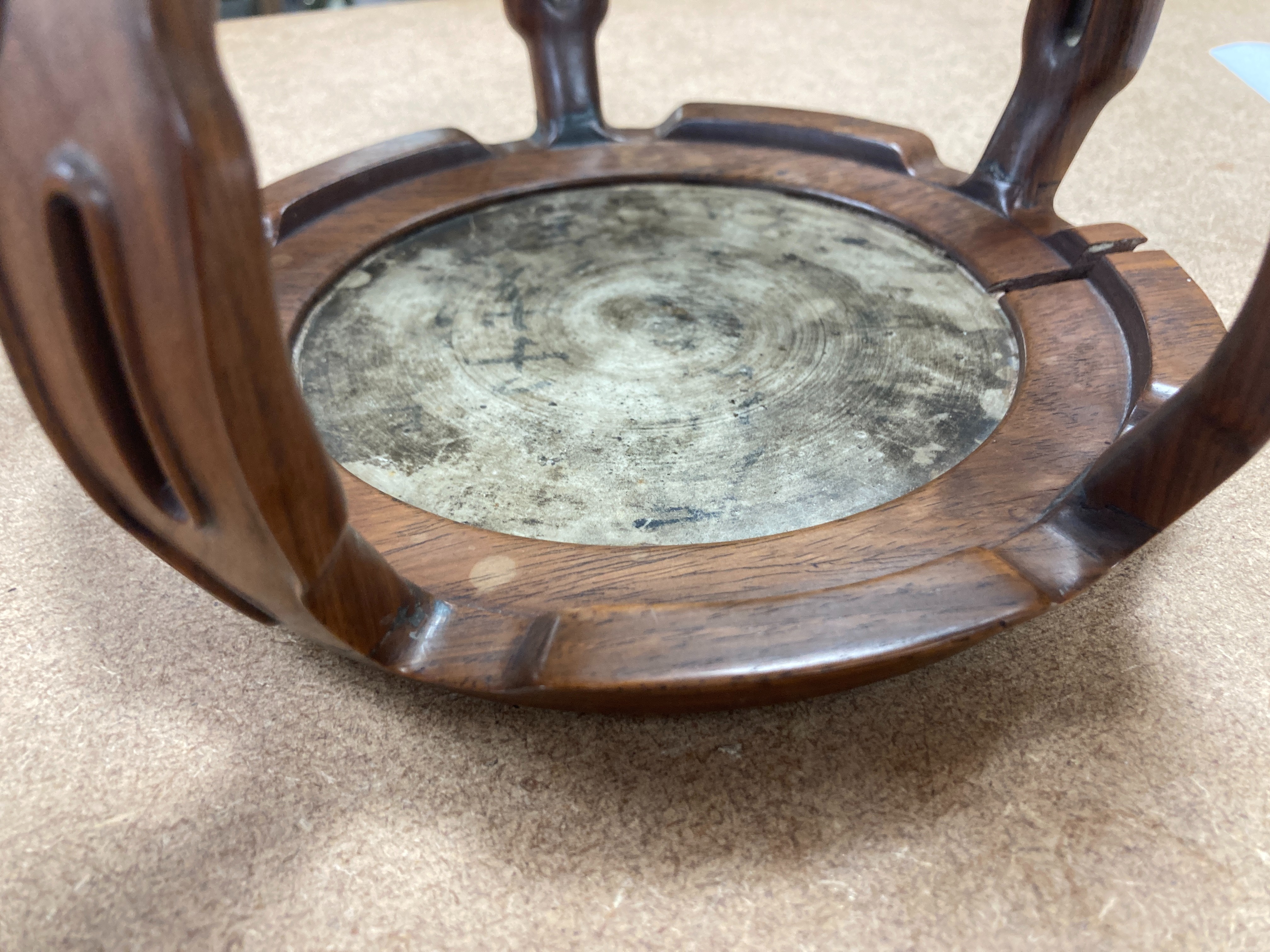 A 19th century Chinese blue and white circular tile inset hongmu stand, 22cm